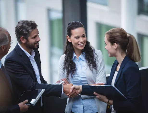 businesspeople-having-discussion-in-office