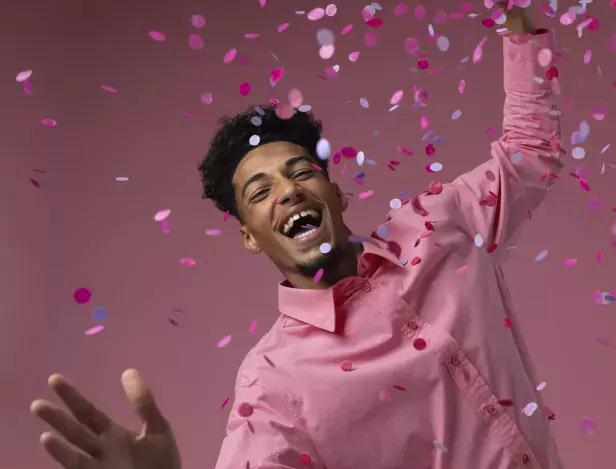 man-dancing-with-confetti-medium-shot-(1)