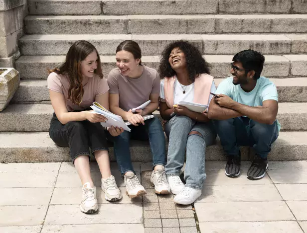 colleagues-studying-together-in-front-of-their-college-before-an-exam